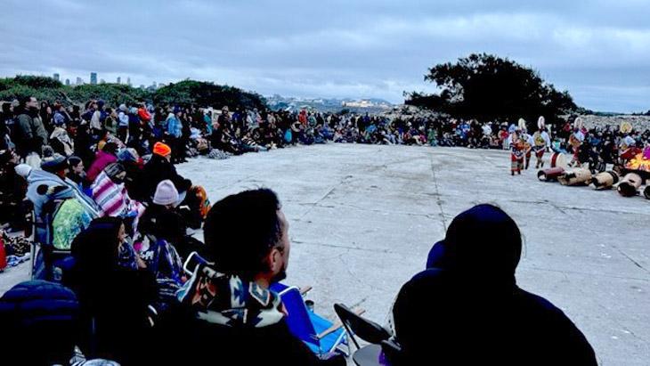 Native students, staff, and faculty gather for the Sunrise Ceremony on Alcatraz Island to celebrate Indigenous Peoples Day.