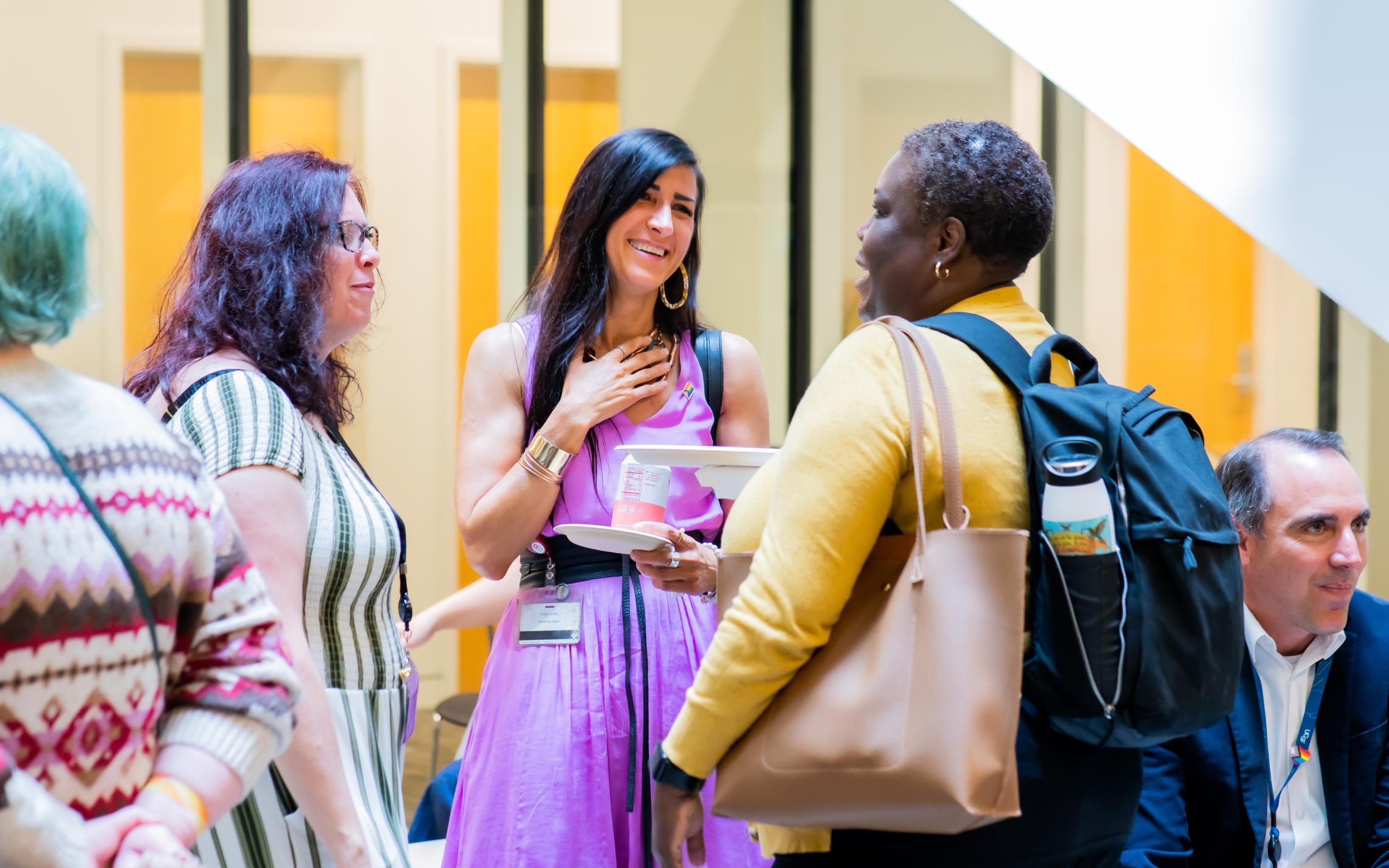 Attendees mingle and chat at the 2023 Diversity and Inclusion Certificate Program graduation celeberation.